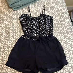 XS Navy blue romper with a white heart polka dot pattern. Worn once.